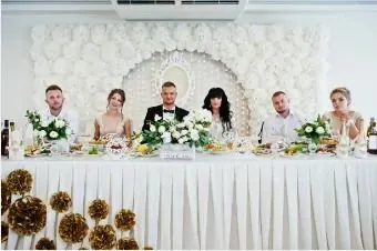 Sofa or head table: two ways to showcase the couple.
